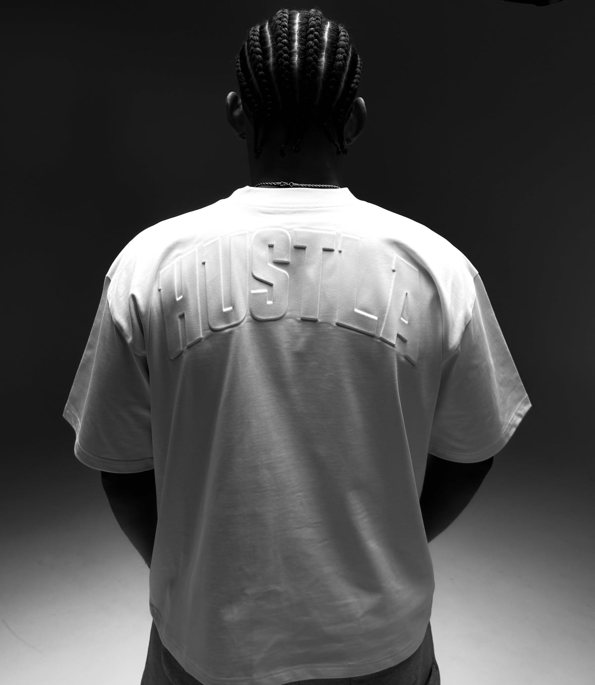HUSTLA white embossed tee campaign
